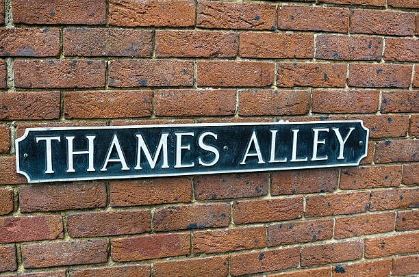 istock Weathered Street Sign on a Red-Brick Wall 481204356