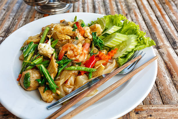 istock Fried vegetables and seafood in sauce 481207146
