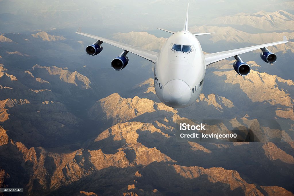 Flying airplane Above Stock Photo