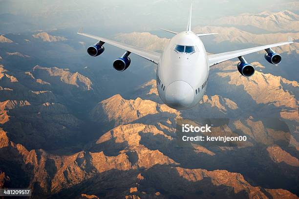 Flying Airplane Stock Photo - Download Image Now - Above, Aerial View, Air Vehicle