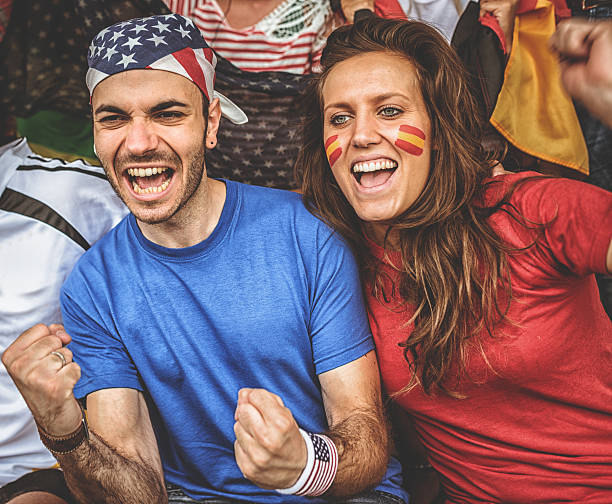 istock american and spanish supporter at the soccer stadium 481209603