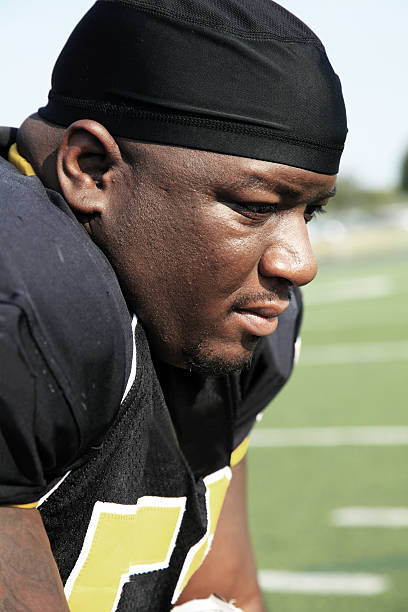 istock Depressed football player looking down 481209923
