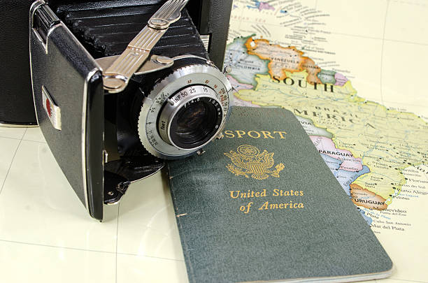 istock Antique Bellows Camera, USA Passport, and Map 481210083
