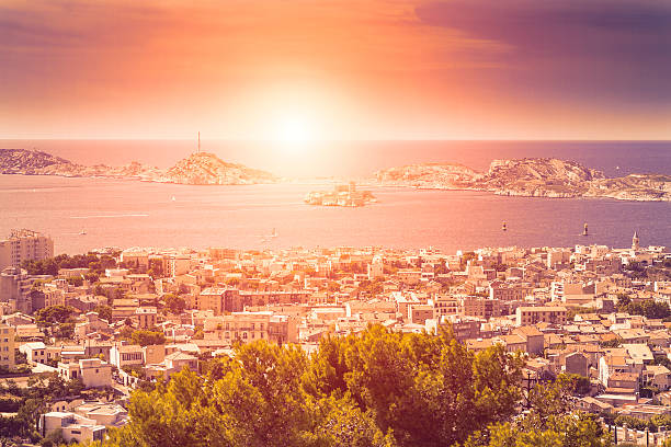 Panoramic view of Marseille at sunset (France) Panoramic view of Marseille at sunset with Château d'If in background (France) frioul archipelago stock pictures, royalty-free photos & images