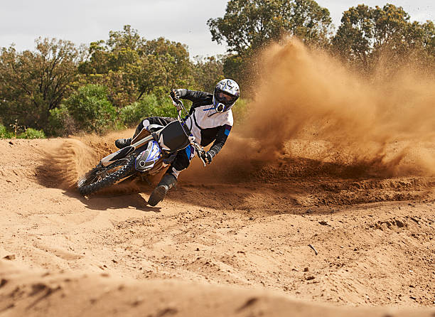 istock Picking up speed as he exits the corner 481211540