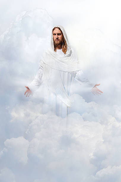 Jesus Christ In Heaven Jesus Christ in Heaven, surrounded by clouds. Lots of extra clouds for additional cropping options. ceremonial robe stock pictures, royalty-free photos & images