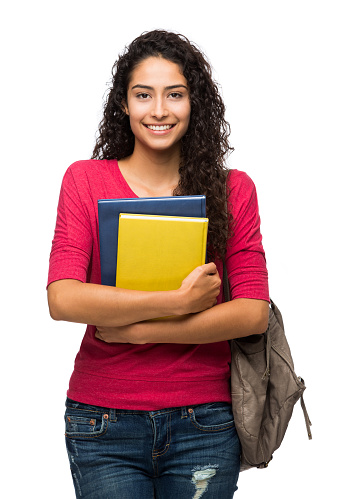 Confident female college student standing isolated over white background
