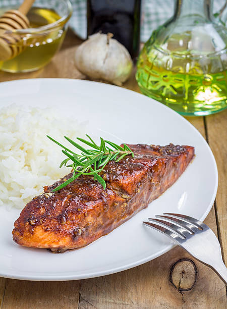 istock Baked salmon fillet in balsamic-honey sauce with rice 481212818