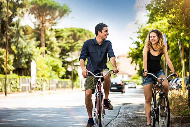 istock Beautiful couple cycling on the road 481220364