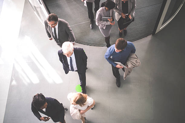 group of  businesspeople walking - girmek stok fotoğraflar ve resimler