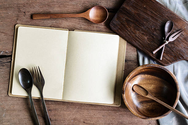 istock Notebook and wooden utensil in kitchen on old wooden background 481235470