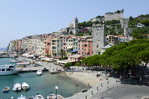 Portovenere, Italy - 7 July 2015: People swimming and sunbathing at the town of Portovenere on Italy