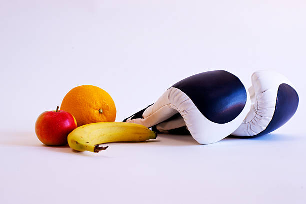 Boxing gloves and fruits stock photo