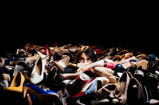 Woman choosing high heels in a store
