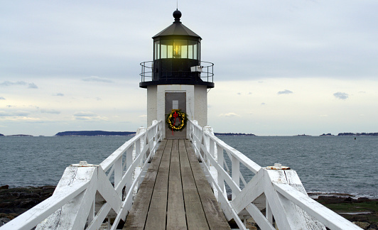 Marshall Point Lighthouse, located Port Clyde, Rockland Maine.  The lighthouse is decorated for Christmas holiday season.