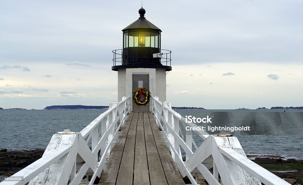 Decorated for the Holidays Marshall Point Lighthouse, located Port Clyde, Rockland Maine.  The lighthouse is decorated for Christmas holiday season. Christmas Stock Photo