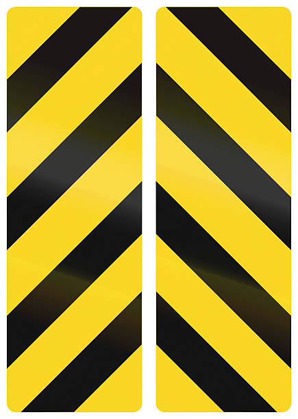 Vertical Chevron Alignments In Canada Collection of Canadian chevron alignments pointing down. This sign is used in Ontario. road chevron warning signs stock pictures, royalty-free photos & images