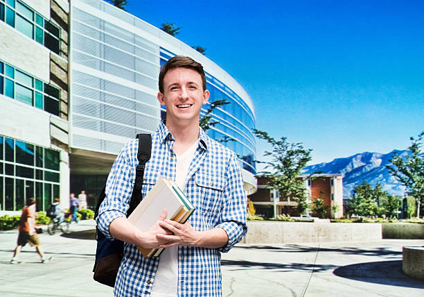 istock Smiling male student in university campus 481243728