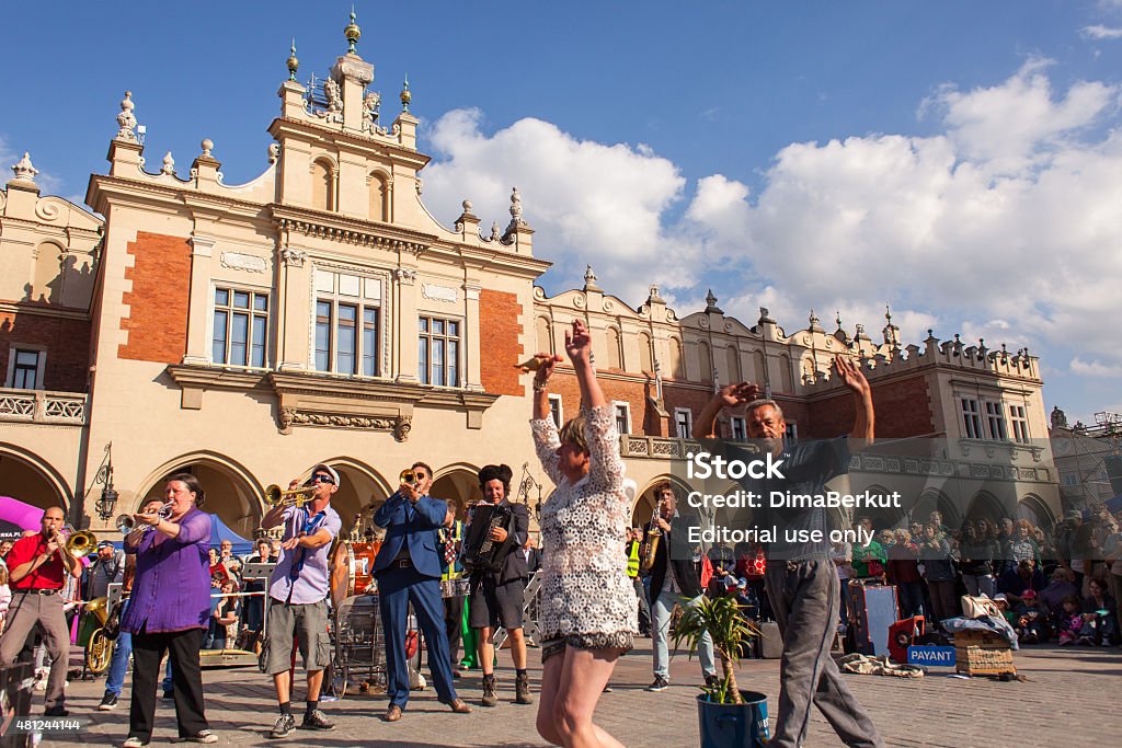 28th International Festival of Street Theatres Krakow, Poland - July 10, 2015: Participants at the annually (July 9-12) 28th International Festival of Street Theatres - Orchestre International du Vetex (Belgium/France) in the Main Square of Krakow. Laughing Stock Photo