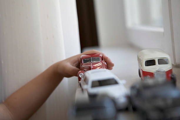 istock Boy Playing With Toy Cars 481244575
