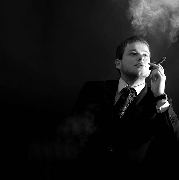 istock Man in a suit smoking  cigar 481247706