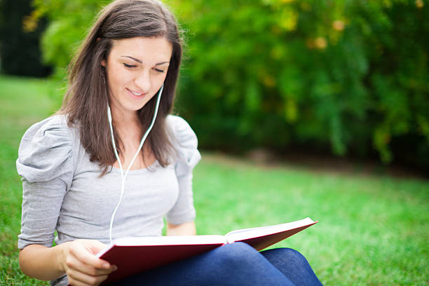 istock Woman relaxing in a park 481248323