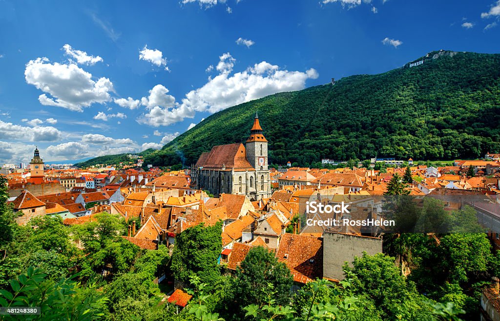 Brasov cityscape in Romania Brasov cityscape with black cathedral and mountain on backround in Romania 2015 Stock Photo