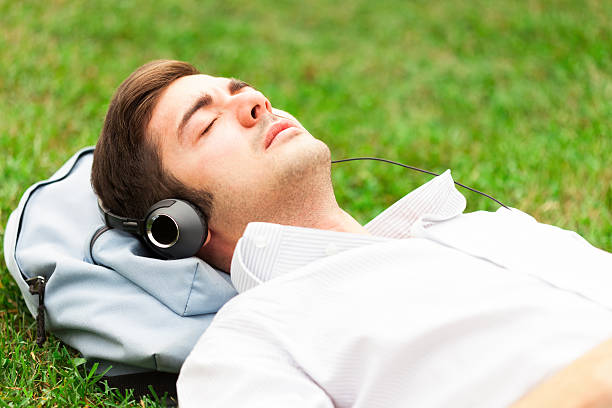 istock Relaxed man listening music 481251183