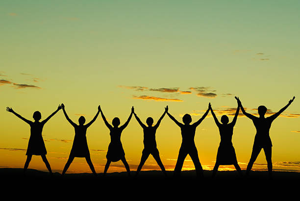 feliz celebrando mujeres - human hand holding hands hands clasped group of people fotografías e imágenes de stock