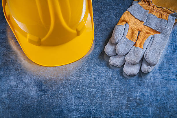 istock Building helmet and protective working gloves on scratched metal 481253314
