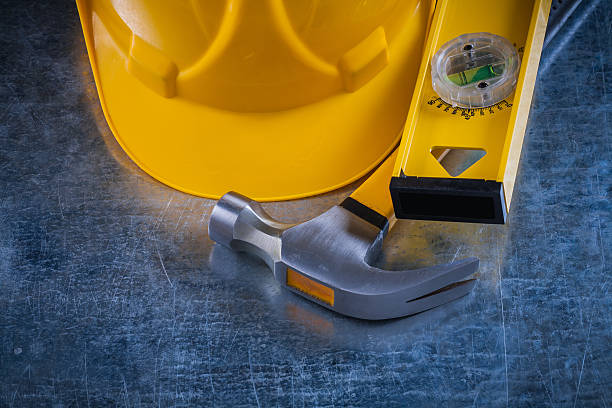 istock Claw hammer wooden construction level and building helmet on scr 481253344