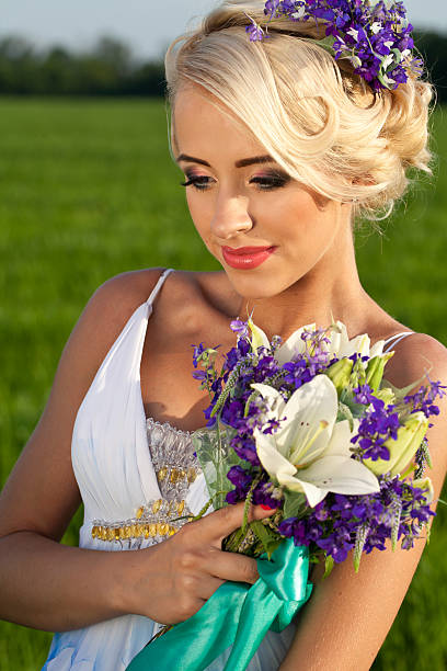 istock Beautiful bride blond blue eyes green field 481253520