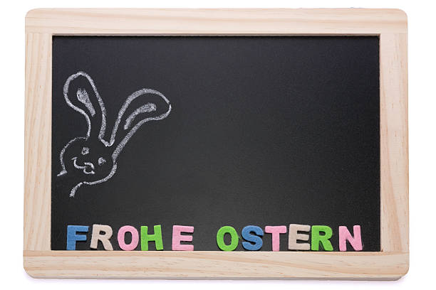 Slate board with chalk bunnies Happy Easter stock photo