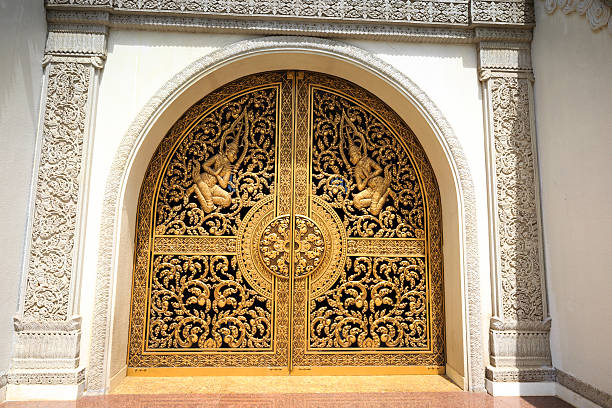 Ho Chi Minh City, Vietnam - July 2, 2015: the main gate of the Buddhist Temples Buu Long in Ho Chi Minh City, Vietnam. This very heavy gates, cast bronze and gilded