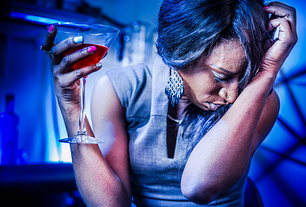 istock Mature black woman drink coctail 481259123