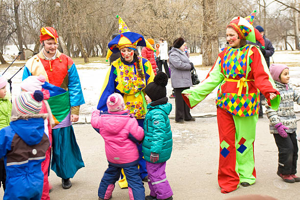 Moscow, Russia – March 2 , 2014: maslenitsa (pancake week, shrovetide) - carnival of farewell winter and meeting spring in Moscow, artists playing with children.