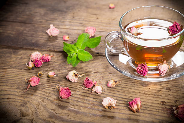 istock Cup of green tea with mint and dried roses 481260350