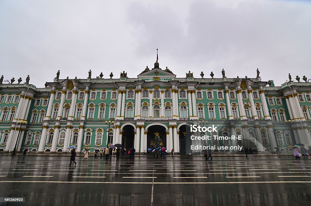 Rain Falls Outside The Hermitage St. Petersburg, Russia - September 23, 2012:  Rain falls as people pass The State Hermitage museum in St. Petersburg, Russia. Architecture Stock Photo