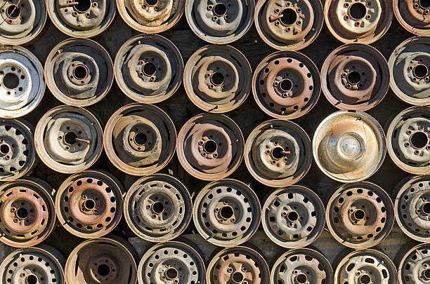Old Rusty Cans on Ground - Weathered and exposed to the elements, rusty old cans outdoors in pile on ground.