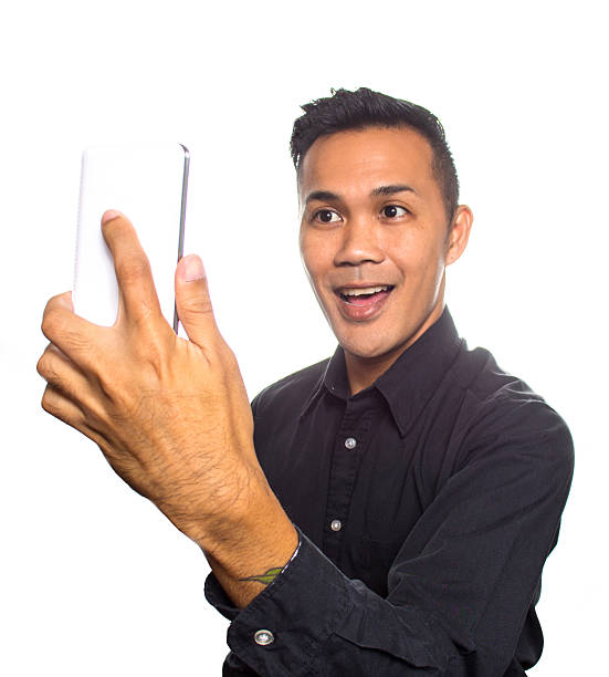 Mixed Asian Man Taking a Selfie stock photo