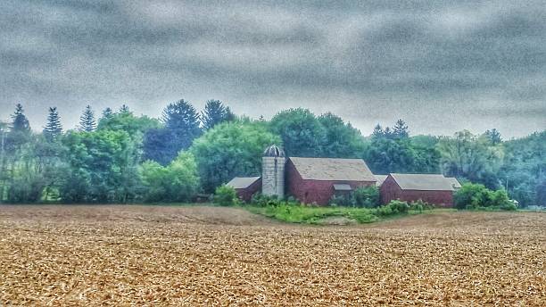 istock New England Red Farm Barn and Silo with Cut Crops 481270190