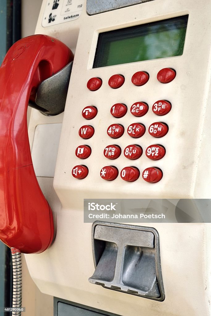 Public payphone with keyboard Public pay phone with keyboard 2015 Stock Photo