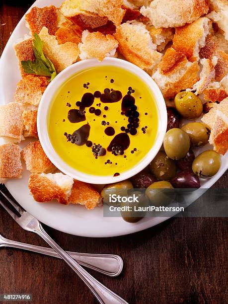 Olive Oil And Balsamic Vinegar With Crusty French Bread Stock Photo - Download Image Now