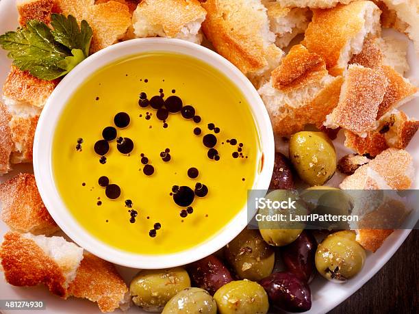 Olive Oil And Balsamic Vinegar With Crusty French Bread Stock Photo - Download Image Now