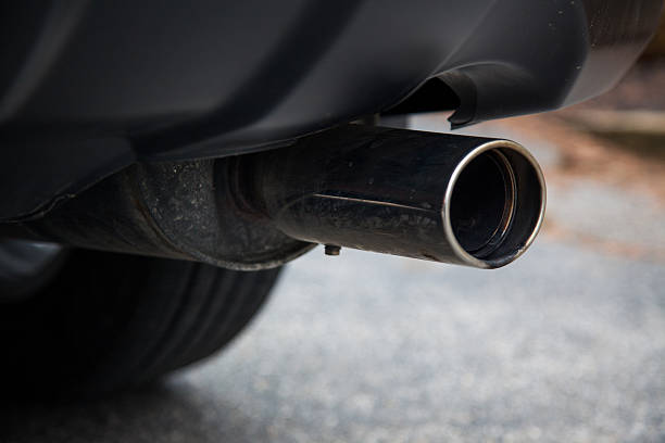 Car Muffler A gas muffler on a car. exhaust pipe photos stock pictures, royalty-free photos & images