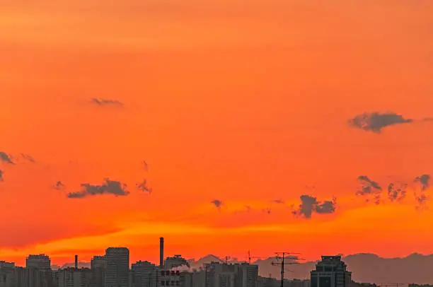 Brightorange sunset over skyline. Moscow, Russia.