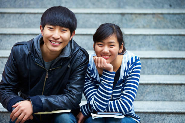 istock lovely college friends smile at camera 481276609