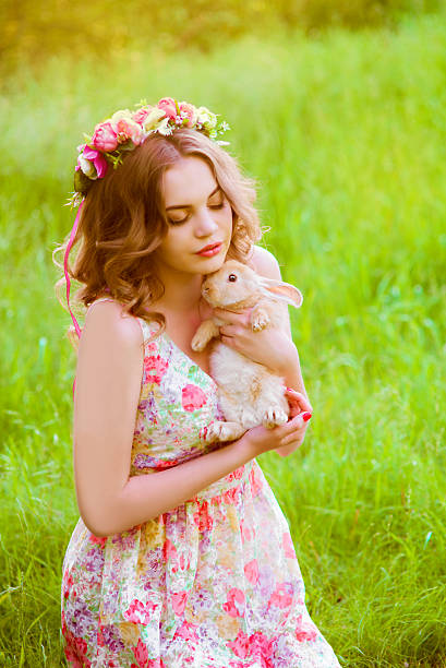 istock Beautiful girl with a rabbit in the hands 481277730