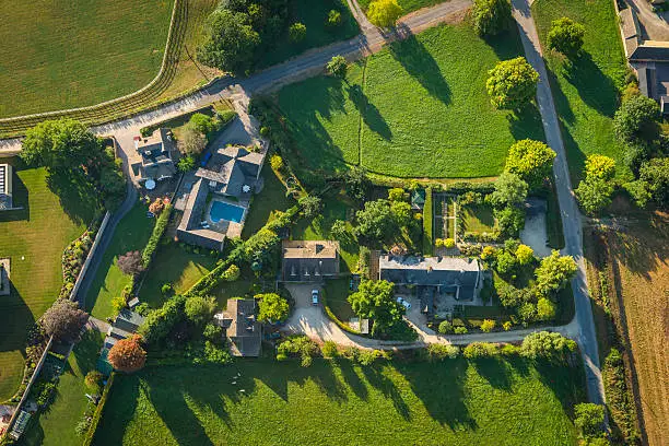 Photo of Rural homes picturesque country village green summer fields aerial photo