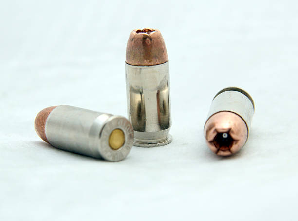 Hollow Point Bullet Hollow Point caliber 45 ACP Bullet. acute angle stock pictures, royalty-free photos & images